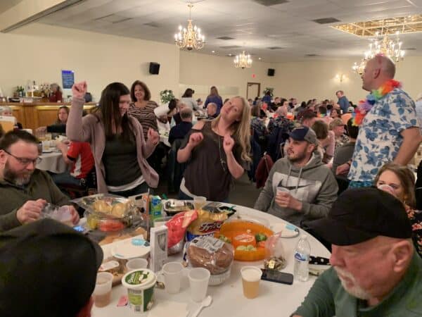 a group or participants at the trivia night dancing