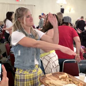 a lady dancing at a trivia night