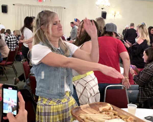 a lady dancing at a trivia night